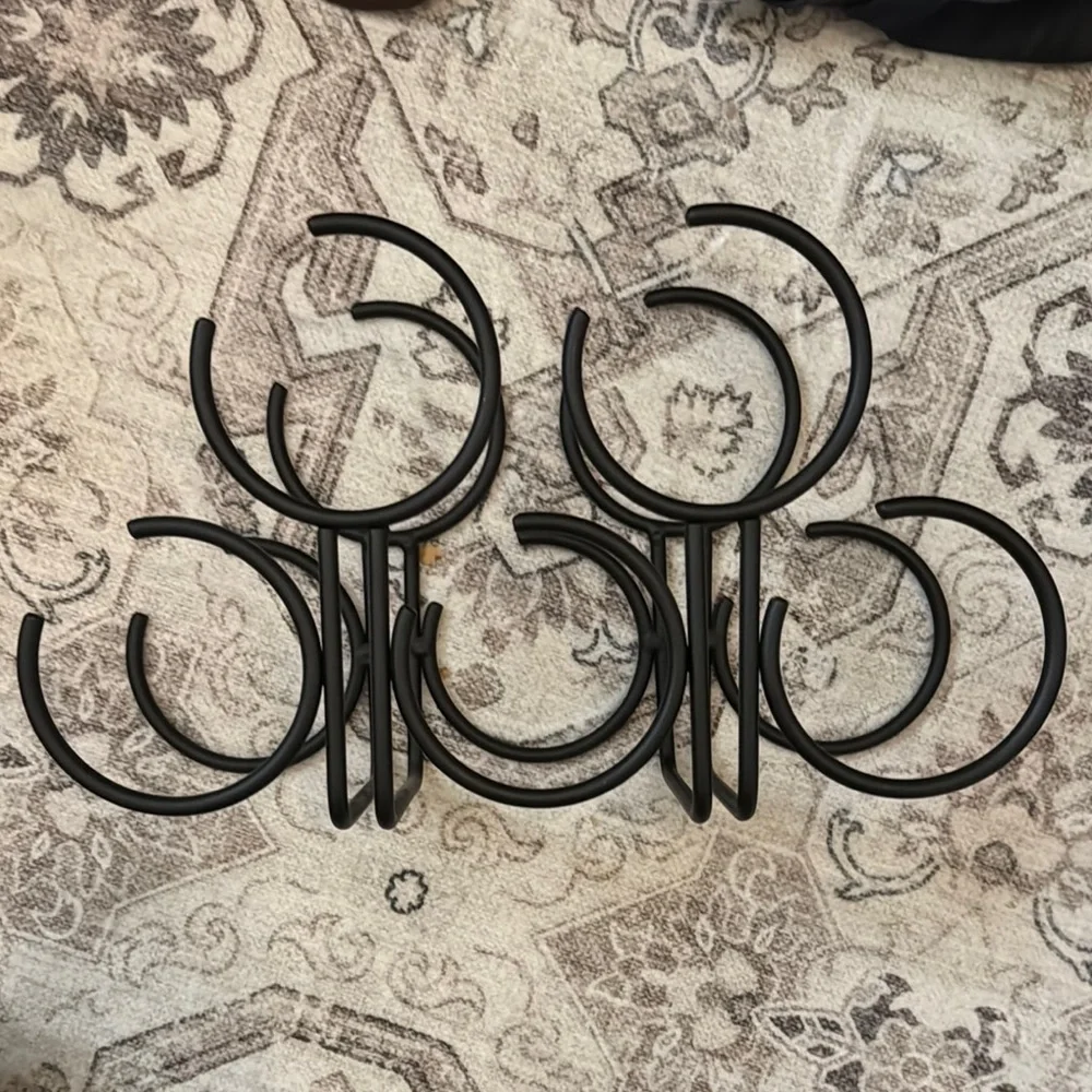 Gently used black metal wine holder